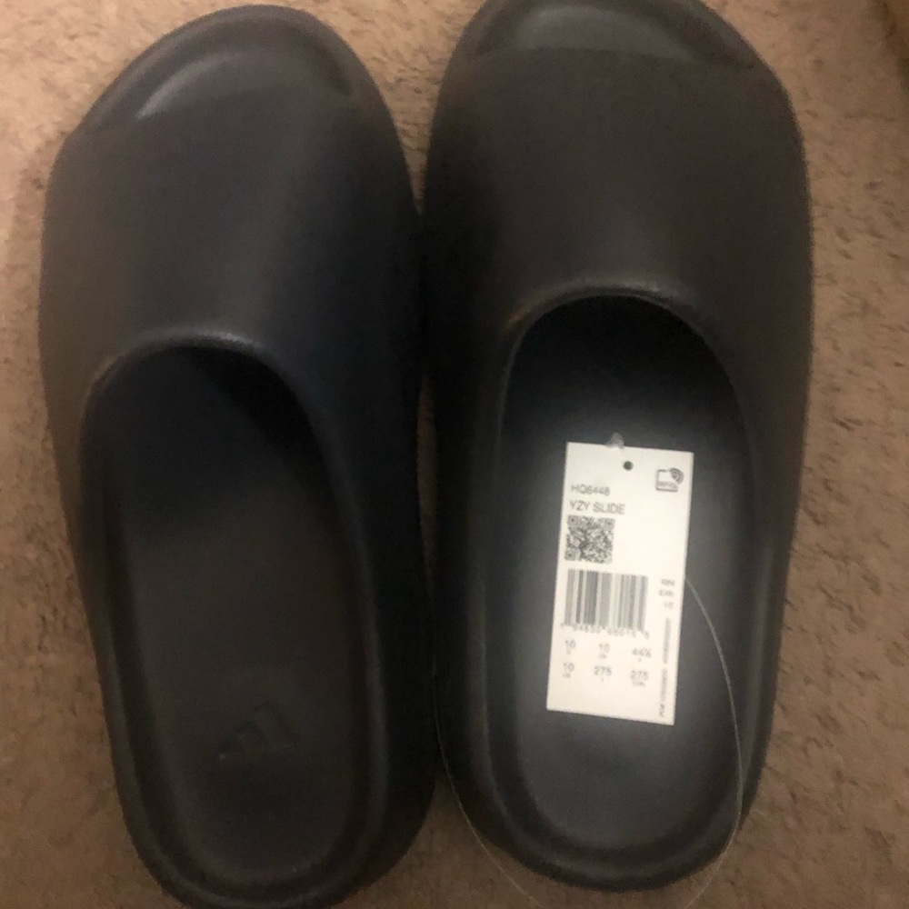 Men -size 10 Adidas Yeezy slide .